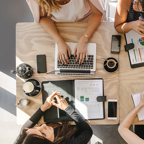 Two women discussing labels and marketing