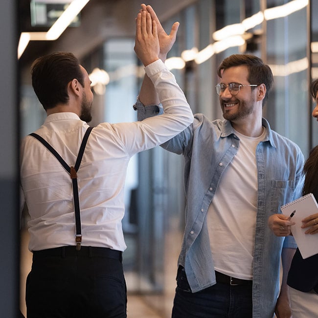 Two ESOP employees high-fiving