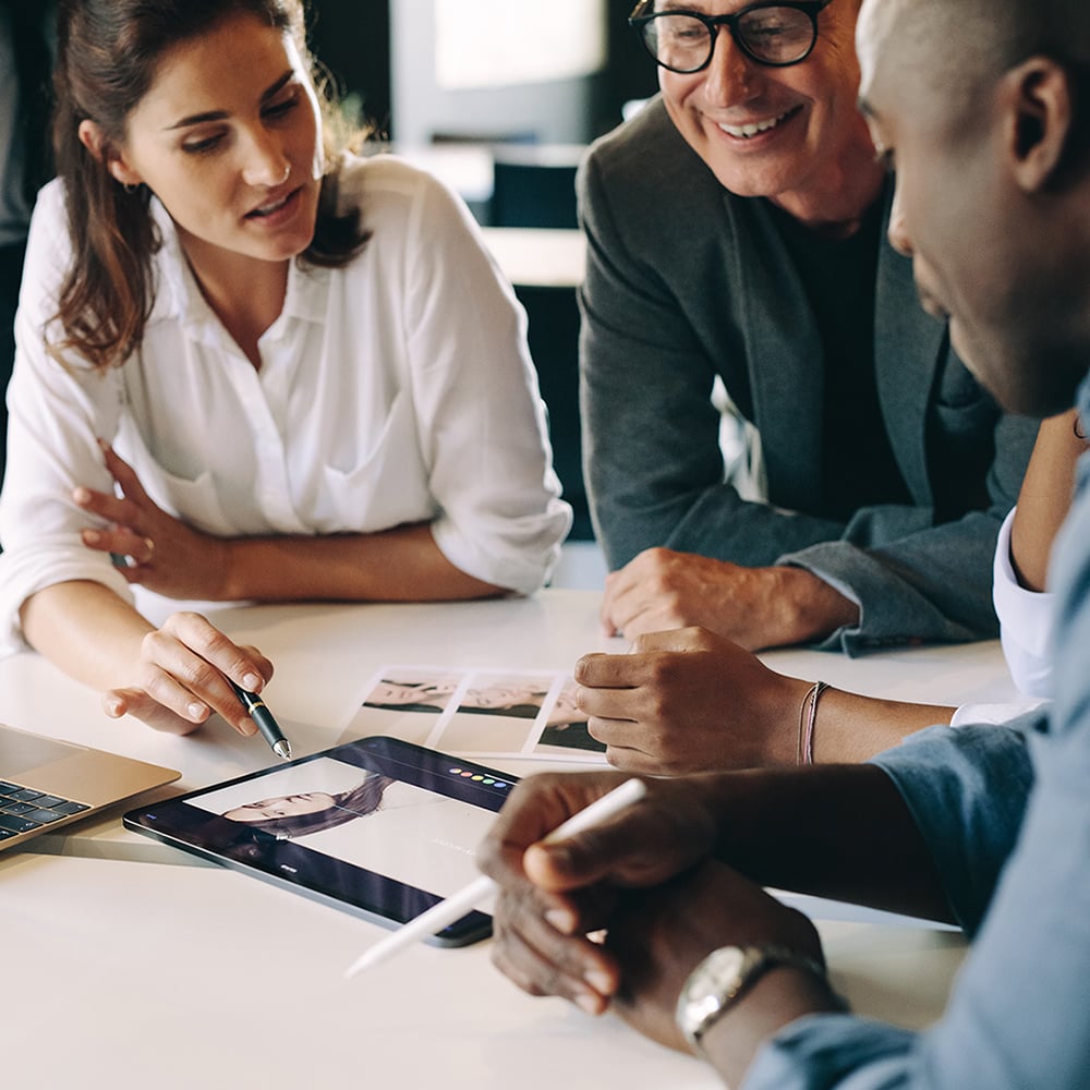 Two marketing professionals helping business owner 