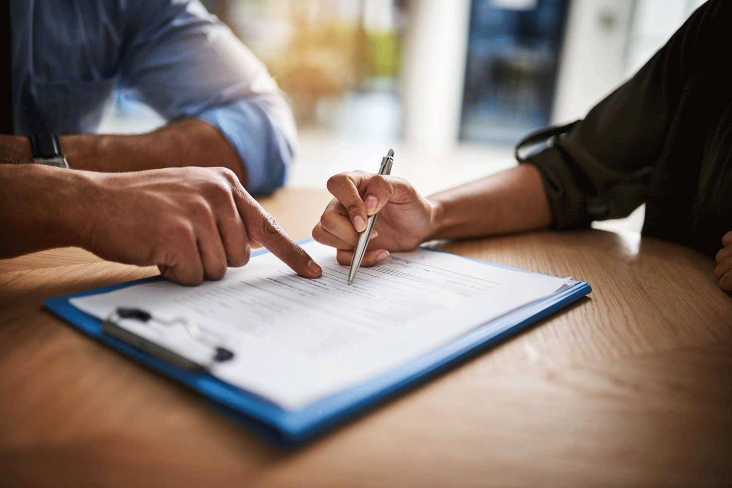 Person signing customized moving forms 