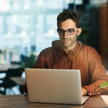 Man using eCommerce portal to monitor supply chain